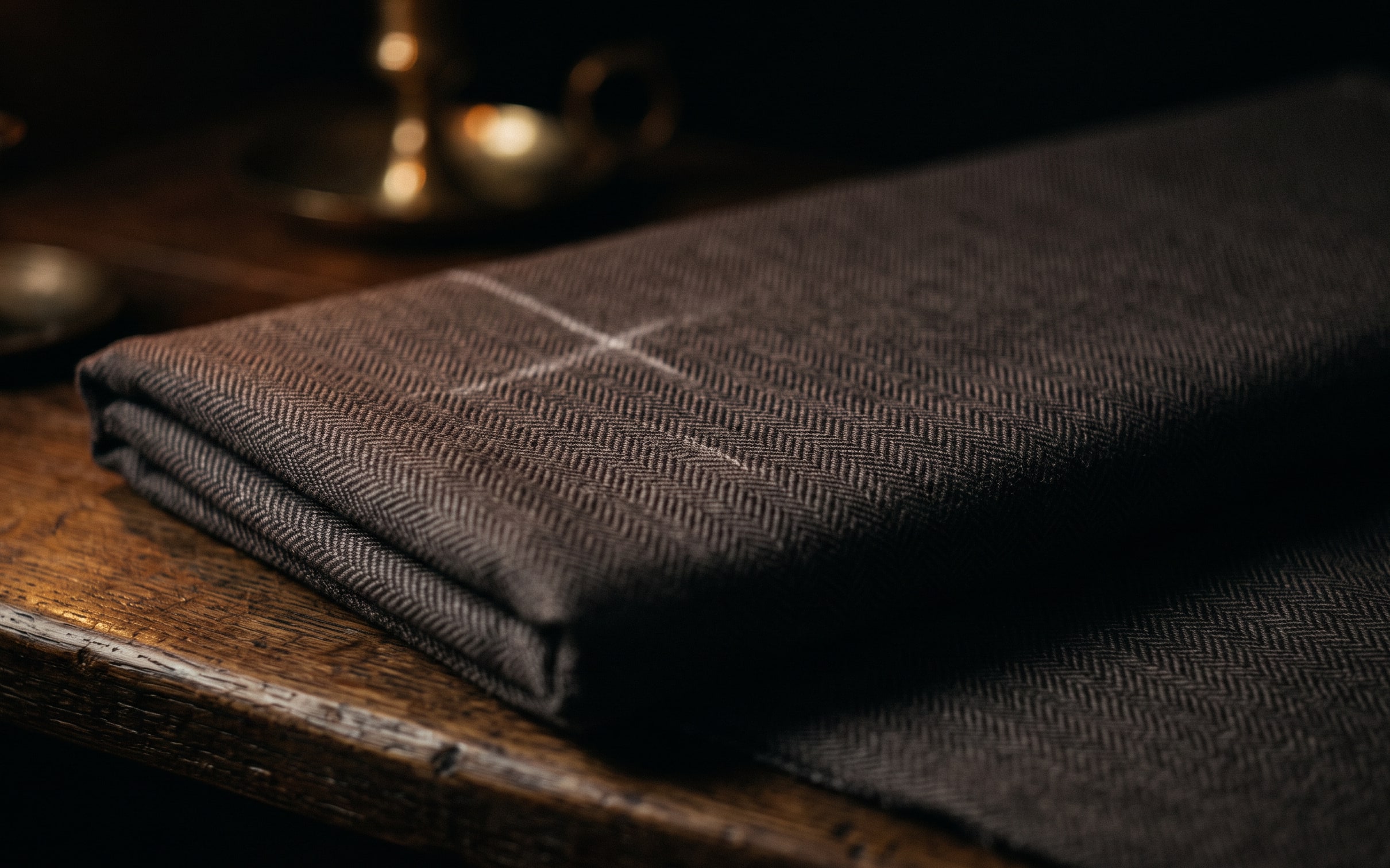 A close view of fine espresso-brown herringbone wool